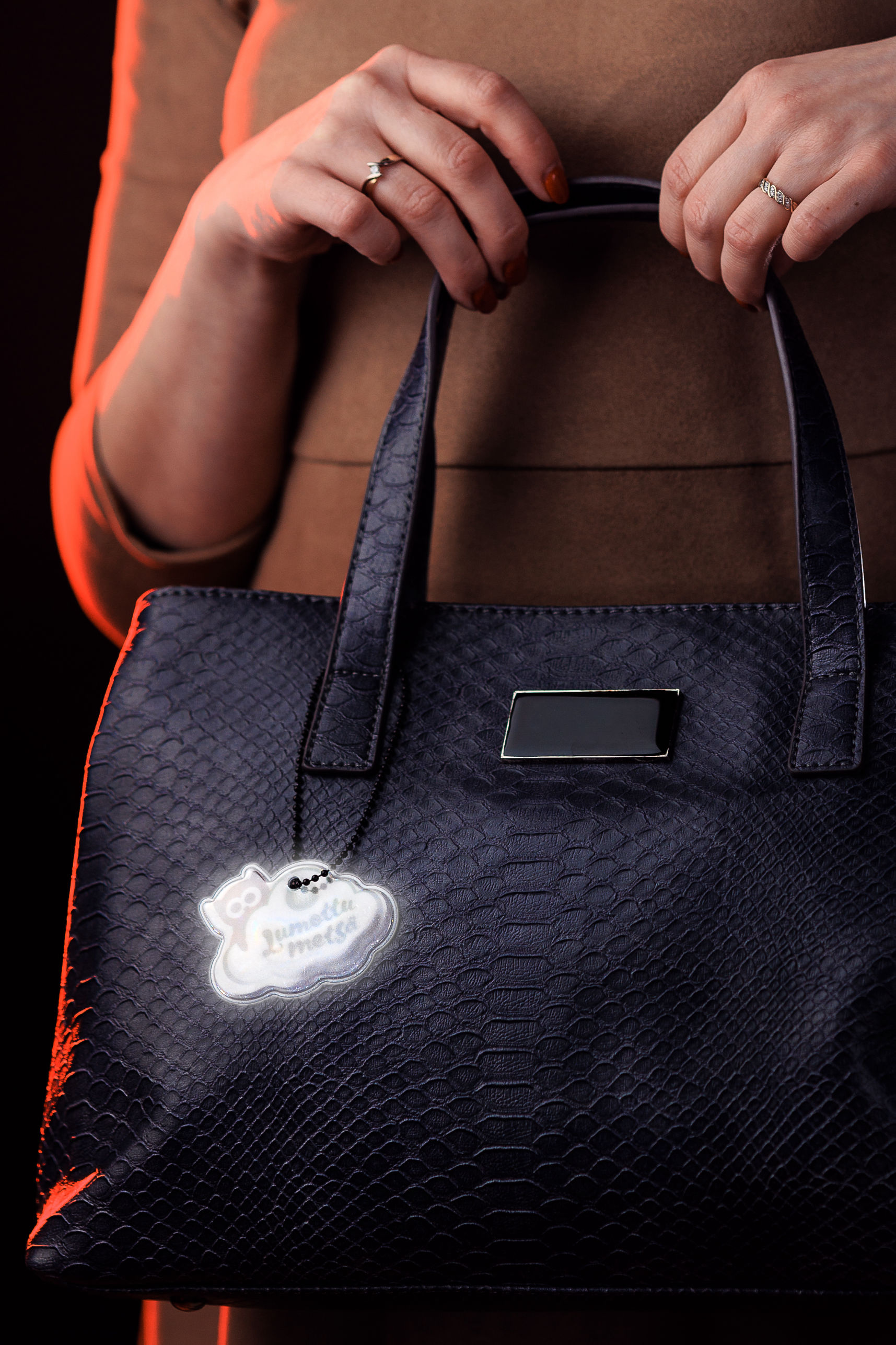 Fashionable reflective soft hanger on handbag