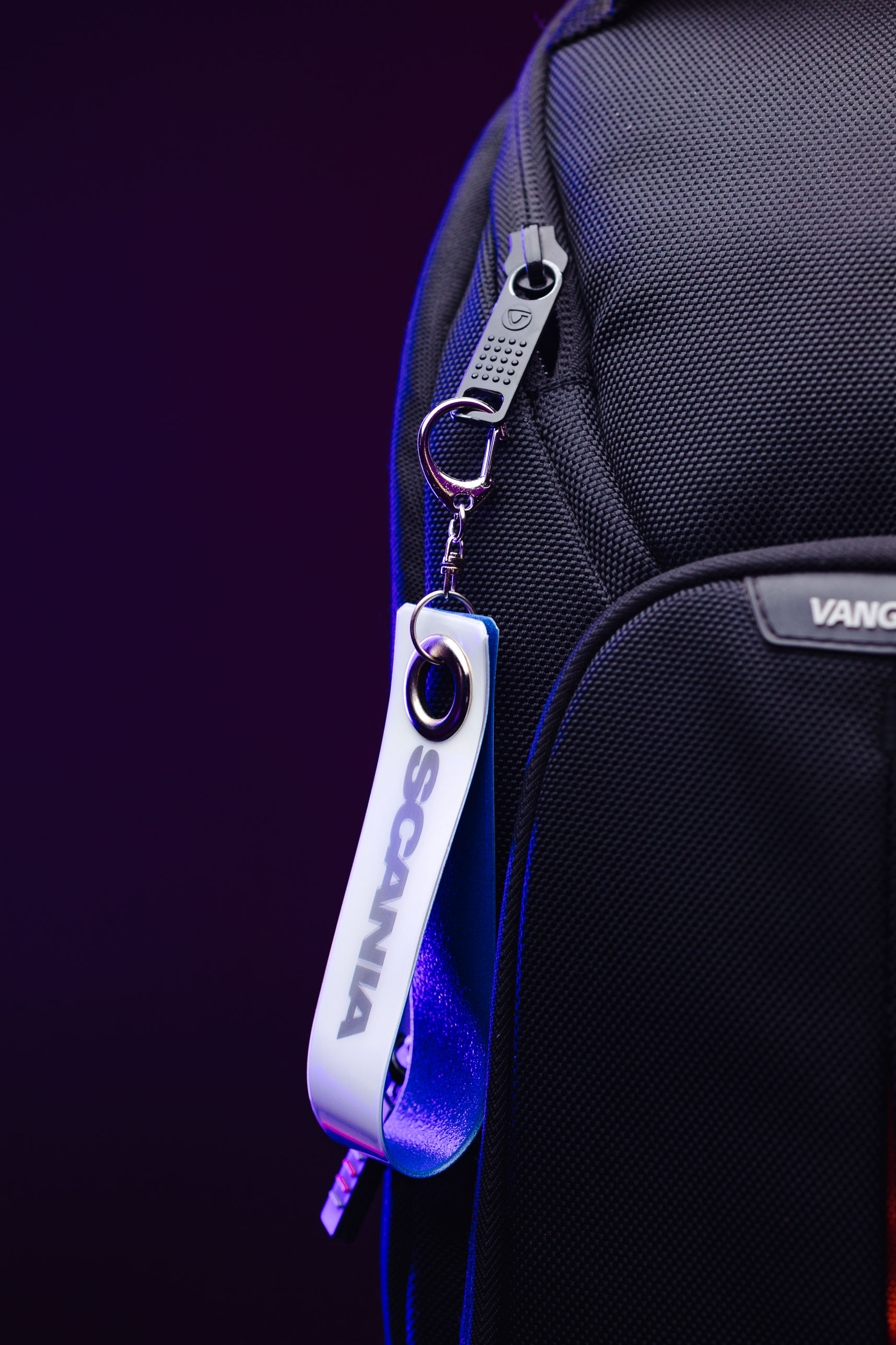 Branded reflective loop strap on bag